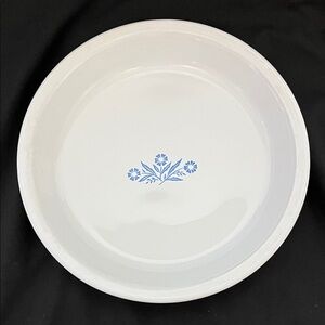 Corning Ware pie plate featuring the iconic blue cornflower pattern